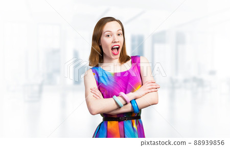 Caucasian woman standing with folded arms Caucasian woman standing with folded arms 88939856