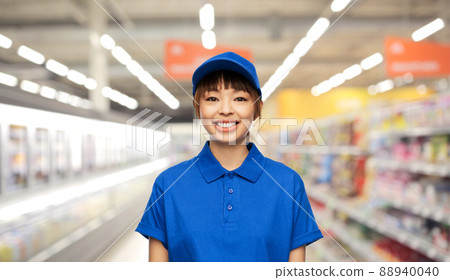 happy delivery woman or saleswoman at supermarket happy delivery woman or saleswoman at supermarket 88940040