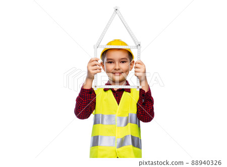 boy in helmet with ruler in shape of house boy in helmet with ruler in shape of house 88940326