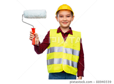 little boy in protective helmet with paint roller 88940339