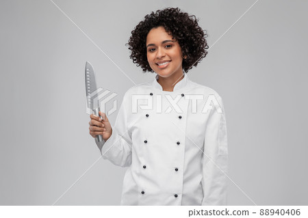 smiling female chef with kitchen knife smiling female chef with kitchen knife 88940406