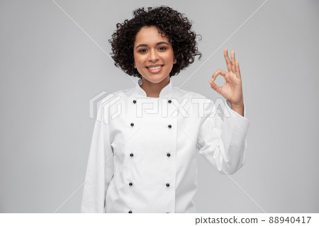 happy smiling female chef showing ok hand sign happy smiling female chef showing ok hand sign 88940417