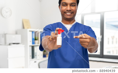 smiling doctor or male nurse with medicine 88940439