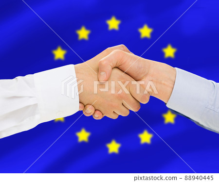 close up of handshake over flag of european union close up of handshake over flag of european union 88940445