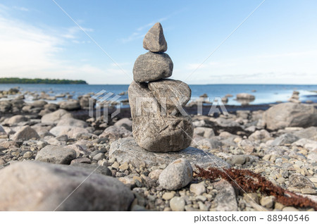 close up of stone pyramids or towers on beach 88940546