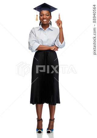 happy female graduate student pointing finger up happy female graduate student pointing finger up 88940564