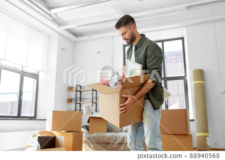 man with boxes moving to new home man with boxes moving to new home 88940568