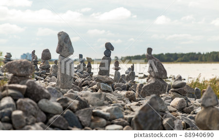 close up of stone pyramids or towers on beach close up of stone pyramids or towers on beach 88940690