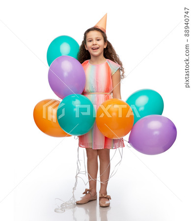 happy girl in birthday party hat with balloons happy girl in birthday party hat with balloons 88940747
