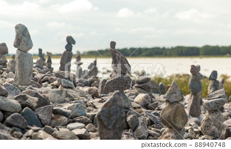close up of stone pyramids or towers on beach 88940748