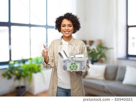 happy smiling woman sorting metallic waste 88940881
