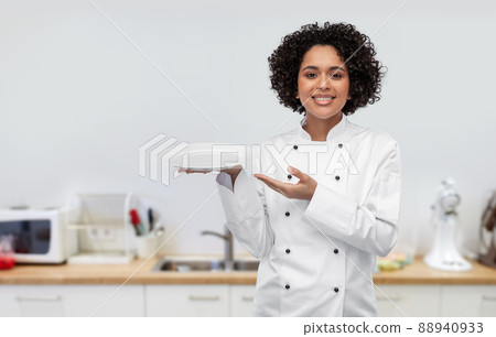 happy smiling female chef holding empty plate 88940933