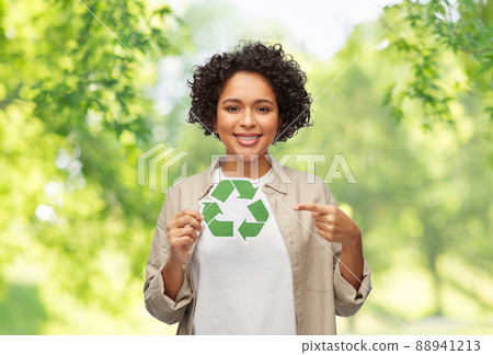 happy woman holding green recycling sign 88941213