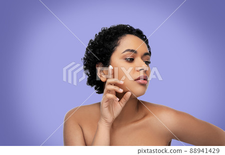 young african american woman with moisturizer young african american woman with moisturizer 88941429