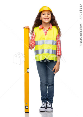 little girl in construction helmet with level 88941542