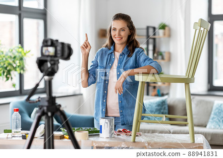 woman or blogger showing old chair renovation woman or blogger showing old chair renovation 88941831