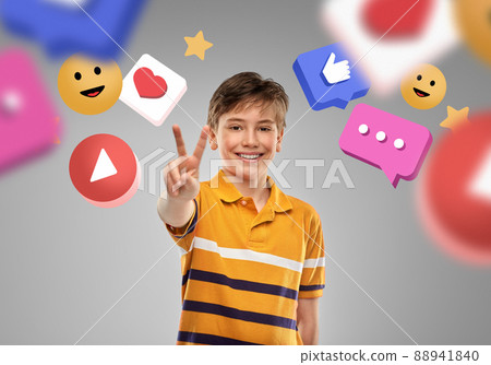 happy boy showing peace over internet icons 88941840