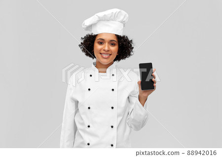 smiling female chef showing smartphone smiling female chef showing smartphone 88942016