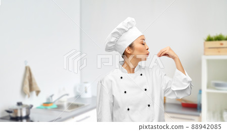 happy female chef making gourmet gesture happy female chef making gourmet gesture 88942085