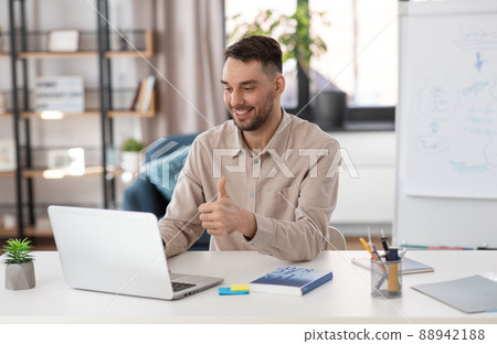 teacher with laptop having online class at home teacher with laptop having online class at home 88942188