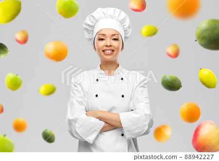 smiling female chef in white jacket smiling female chef in white jacket 88942227