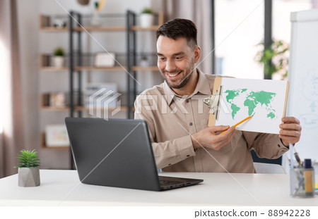 teacher with world map having online class at home teacher with world map having online class at home 88942228