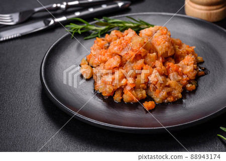 A delicious dish of hake fish in chunks in tomato sauce with spices and herbs A delicious dish of hake fish in chunks in tomato sauce with spices and herbs 88943174