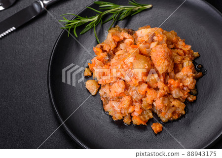 A delicious dish of hake fish in chunks in tomato sauce with spices and herbs 88943175