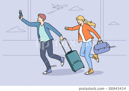 Worried tourists run for flight in airport 88943414