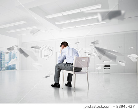 young businessman on chair in office young businessman on chair in office 88943427