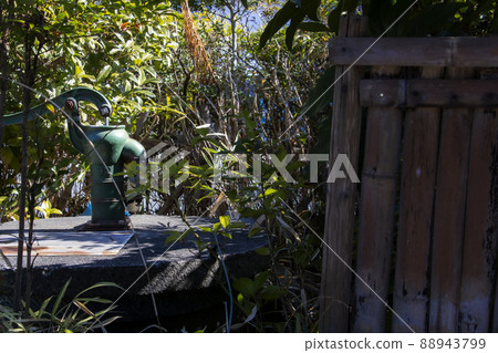 An old well and a hand pump in the garden that can be used for daily life and drinking water in the event of an emergency disaster 88943799