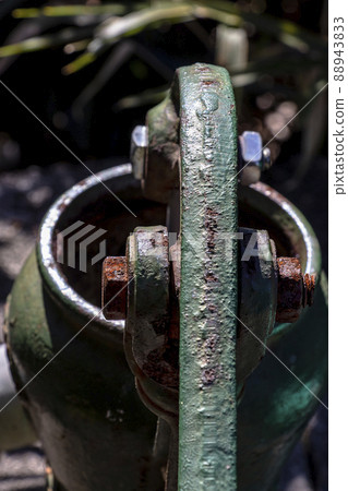 An old well and a hand pump in the garden that can be used for daily life and drinking water in the event of an emergency disaster 88943833