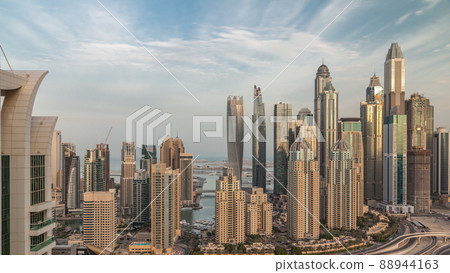 Skyscrapers of Dubai Marina near Sheikh Zayed Road with highest residential buildings morning timelapse Skyscrapers of Dubai Marina near Sheikh Zayed Road with highest residential buildings morning timelapse 88944163