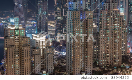 Skyscrapers of Dubai Marina near intersection on Sheikh Zayed Road with highest residential buildings night timelapse 88944233