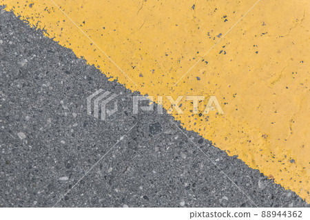 Asphalt street road markings with yellow paint abstract background design pattern 88944362