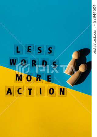 Message LESS WORDS MORE ACTION. Motivational Words Quotes Concept. Colorful yellow blue background. Minimalistic creative concept of support and acting. Stand with Ukraine Ukrainian flag Message LESS WORDS MORE ACTION. Motivational Words Quotes Concept. Colorful yellow blue background. Minimalistic creative concept of support and acting. Stand with Ukraine Ukrainian flag 88944604