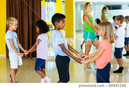 Little boys and girls dancing pair dance in the ballet studio Little boys and girls dancing pair dance in the ballet studio 88945298