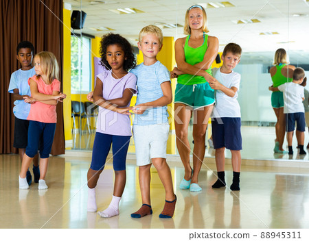 Little boys and girls dancing pair dance in the ballet studio Little boys and girls dancing pair dance in the ballet studio 88945311