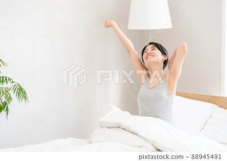 Morning awakening woman bed 88945491