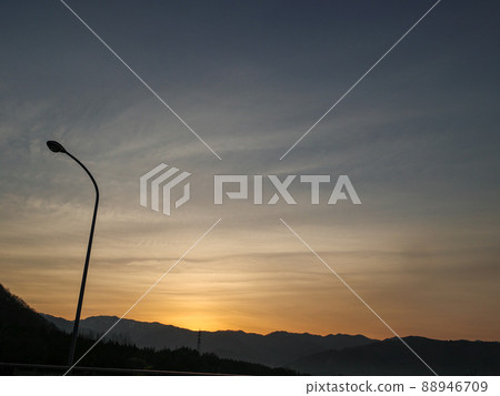 Gradation of clouds before the rising sun. Put on the street light Gradation of clouds before the rising sun. Put on the street light 88946709