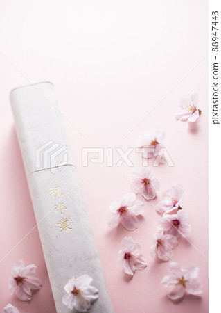 Diploma and cherry blossom petals 88947443