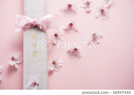 Diploma and cherry blossom petals 88947448