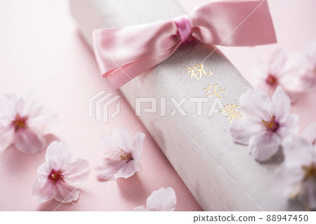 Diploma and cherry blossom petals Diploma and cherry blossom petals 88947450