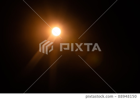 Solar lens flare on black background Solar lens flare on black background 88948150