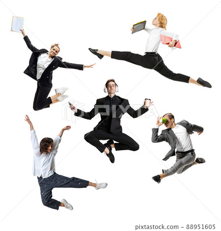 Young office workers jumping and dancing in busness style clothes or suit with folders and gadgets on white background. Creative collage. 88951605