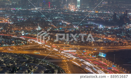 Top view city traffic on a big crossroad in Business bay night timelapse. 88951687