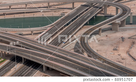 Top view city traffic on a big crossroad in Business bay timelapse. Top view city traffic on a big crossroad in Business bay timelapse. 88951707