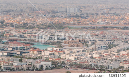 Aerial view of many apartment houses in Dubai city from above timelapse 88951805
