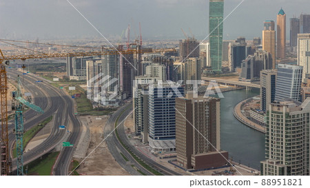 Skyline with modern architecture of Dubai business bay towers timelapse. Aerial view Skyline with modern architecture of Dubai business bay towers timelapse. Aerial view 88951821