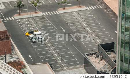 Aerial view of a parking lot with many cars in rows timelapse 88951942